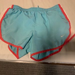 Nike light blue shorts with pink and white edges, awesome for running